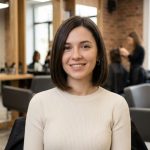Smiling woman with a short bob in a hair salon.